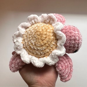 Mini crochet velvet turtle plush with pink shell and white flower headpiece