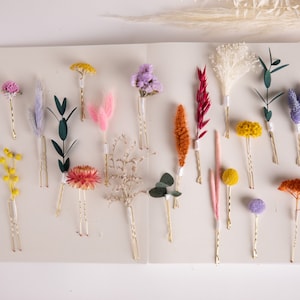 Colorful spring hair pin set with flower and leaf designs, assorted pins