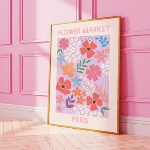 Framed floral wall art print with purple and orange flowers and 'FLOWER MARKET PARIS' text.