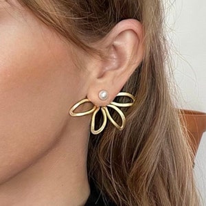 Gold flower-petal ear cuff with pearl center and slim band detail
