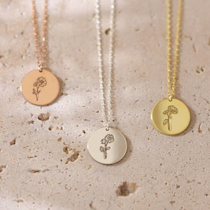 Disc charm necklace with flower tree symbol on round pendants, pearl and gold chains