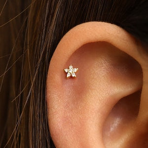 Tiny diamond flower flatback labret stud on ear cartilage