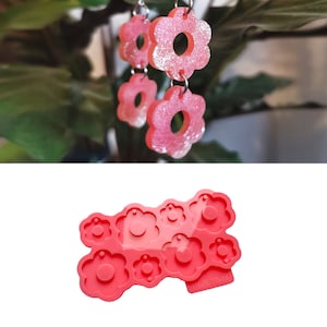 Pink flower silicone mold with multiple 6-petal blossom shapes for resin keychains or charms