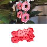 Pink flower silicone mold with multiple 6-petal blossom shapes for resin keychains or charms