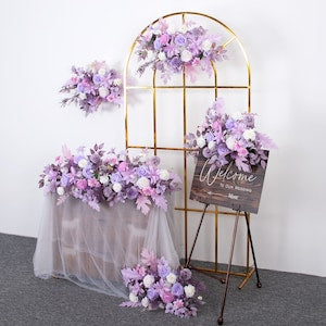 Gold standing floral wedding arch frame with purple and white artificial bouquets