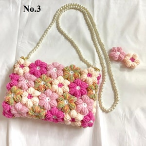 Crochet floral crossbody bag with beaded pearl strap, pink and cream puff flowers