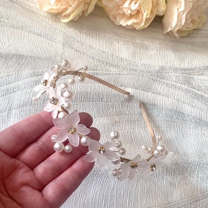 Gold pearl floral headband with white flower clusters and dangling pearl strands