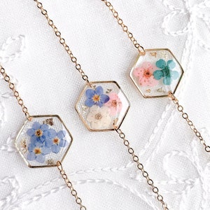 Hexagon flower bracelet with gold chain, pressed forget-me-not style blooms