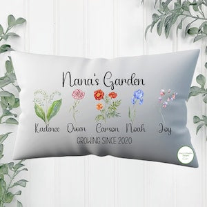 Personalized garden pillow cover with cursive name and multicolor flowers, white fabric