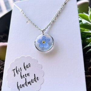 Blue forget-me-not resin pendant necklace with silver chain