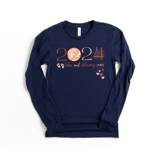 Navy long-sleeve crew shirt with 2024 holiday nurse graphic