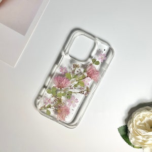 Pink sakura pressed-flower phone case with silver foil, transparent back