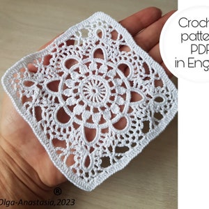 White crochet granny square with detailed floral lace pattern