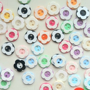 Assorted small flower buttons with round petals, pastel and dark colors, for crafts and clothing
