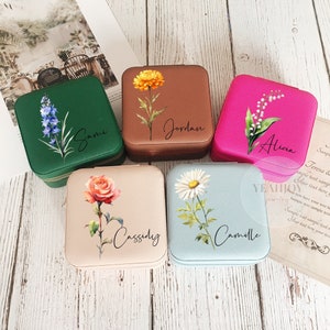 Engraved flower travel jewelry boxes in assorted colors with floral name engravings