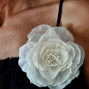 Cream white silk flower brooch with layered petals and jeweled center