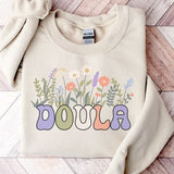 Cream crewneck sweatshirt with colorful wildflower graphic and DOULA text