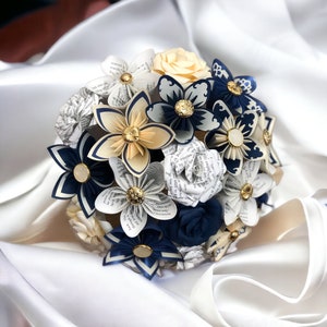 Paper flower bouquet with navy and cream blooms and gold accents