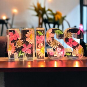 Resin letter night light with embedded dried flowers and warm LED glow