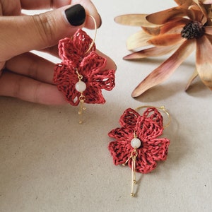 Red floral raffia dangle earrings with small pearl drops