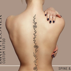 Custom botanical spine tattoo design with vertical vine and small flowers in thin linework