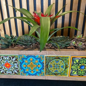 Tiled wooden flower pot with colorful square tile front and green succulents