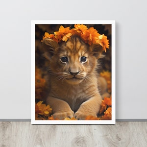 Framed lion cub print with orange flower crown, white frame