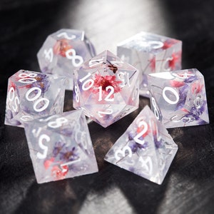 Transparent flower dice set with numbered faces, clear polyhedral dice