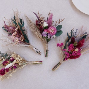 Mini dry flower bundle set with purple and pink blooms and eucalyptus leaves, tied with twine