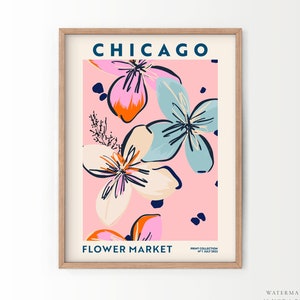 Framed Chicago poster with colorful flower illustrations and text, pink background