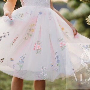 Floral tulle flower girl dress with pastel embroidery and layered full skirt