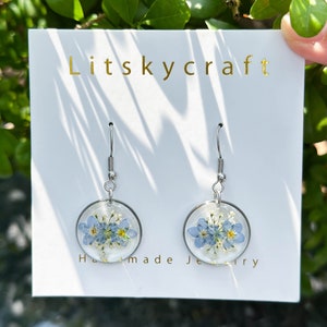Forget-me-not flower resin dangle earrings with blue petals, silver-tone hooks