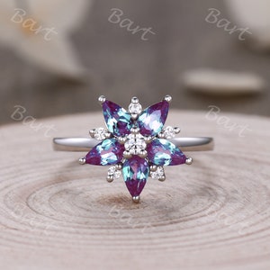 Sterling silver floral cluster ring with pear-cut color-changing alexandrite and round accents