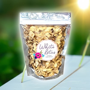 Dried white lotus flowers in a clear foil stand-up pouch with label