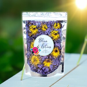 Organic blue lotus flower tea pouch with dried purple blossoms and yellow centers