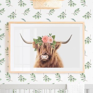 Framed highland cow print with pink flower crown, featuring a brown cow portrait