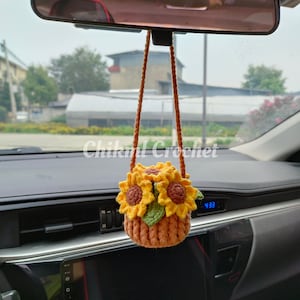 Crochet sunflower car hanging decor with brown cord and yellow flower cluster