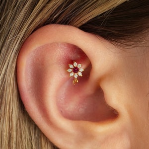 Gold-tone tiny flower hoop earring with red gem accents for cartilage piercing