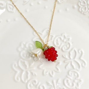 14K gold necklace with red raspberry berry pendant, white flower and green leaf