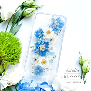 Pressed flower phone case with clear back and blue-and-white floral design