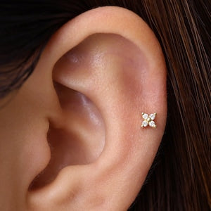 Tiny flower flatback labret stud earring on ear piercing