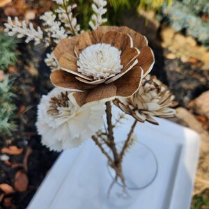 Wood flower bouquet with white blossoms and small wrapped stems