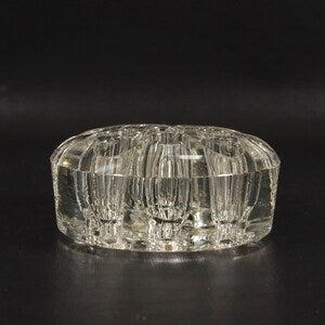 Domed clear glass flower frog with multiple vertical pin holes, 3-inch wide