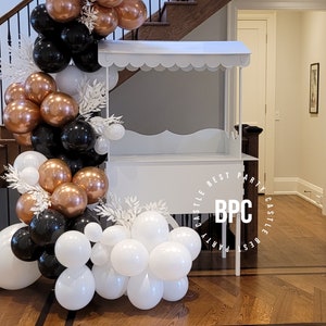 White party decor cart with scalloped canopy and front sign panel