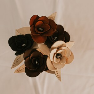 Leather rose bouquet with dark and cream flowers and engraved date/initial tags