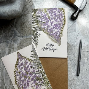 Set of 2 floral greeting cards with purple blossoms and green leaves, birthday message.