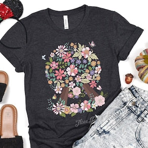 Dark gray floral Epcot T-shirt with colorful flower wreath graphic on chest