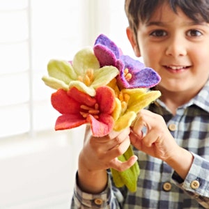 Handmade felt flower bouquet with red, yellow, purple blooms and green leaves