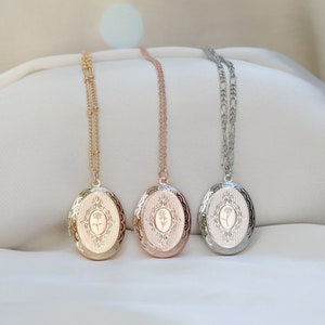 Birth flower oval locket necklace with engraved face, shown in gold, rose gold, and silver