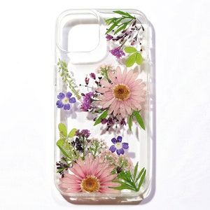 Pressed flower phone case with clear hard shell and pink, purple, and green floral design